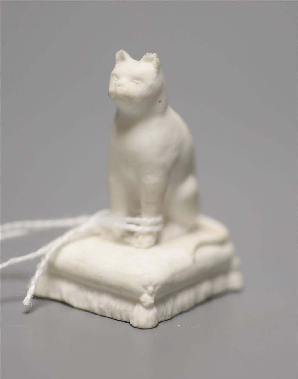 A Rockingham biscuit porcelain seated cat, c.1830, height 5cm